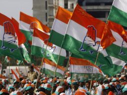 Supporters hold party flags during an election campaign rally by India’s ruling Congress party president Gandhi in Mumbai