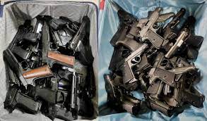 Couple with 45 Assorted Pistols Held at IGI Airport