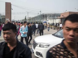 Workers on their lunch break leave the Foxconn plant in Zhengzhou, China, on Oct. 19, 2015. (Gilles Sabri/The New York Times)