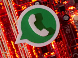 FILE PHOTO: A 3D printed Whatsapp logo is placed on a computer motherboard