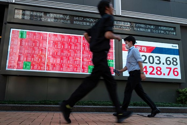 Global shares scale fresh tops in Asia, oil slips on truce talks