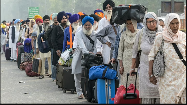 Sikh Pilgrims Cross into Pakistan, Received by Pak Officials with Flowers