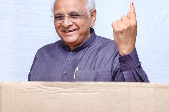 Gujarat Chief Minister Bhupendra Patel shows his ink-marked finger as he casts his vote for the local self-governance election a