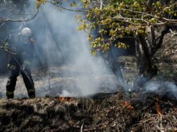 A firefighter works as wildfires continue in Otsuchi, Iwate Prefecture, Japan