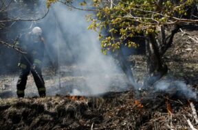 A firefighter works as wildfires continue in Otsuchi, Iwate Prefecture, Japan