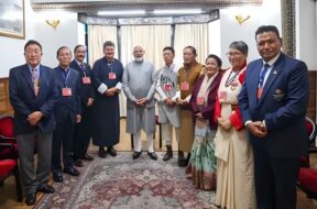 PM Modi alongside Padma awardees