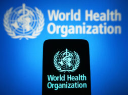 In this photo illustration, the World Health Organization (