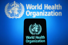 In this photo illustration, the World Health Organization (