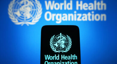 In this photo illustration, the World Health Organization (